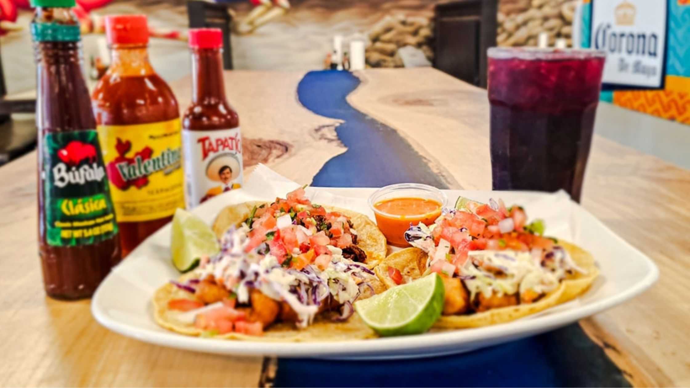 Tacos on a plate with pico on top