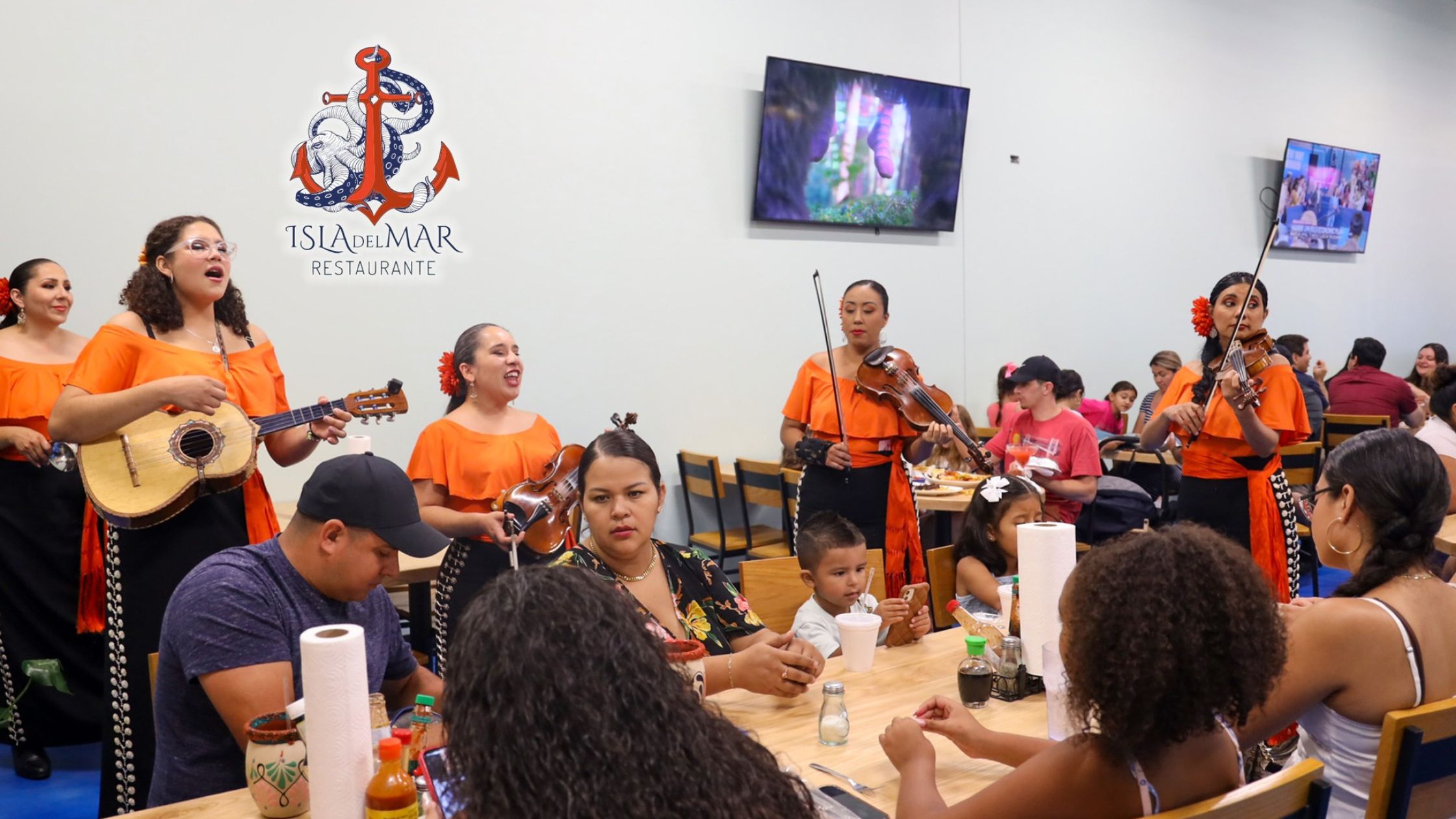 Female mariachi band playing at a restaurant